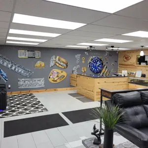KC Gold and Diamond Traders - Lounge Area with Jewelry Mural Wide View